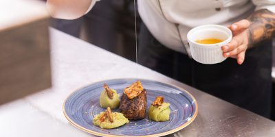 Chef showing his fine cuisine. Professional food decoration