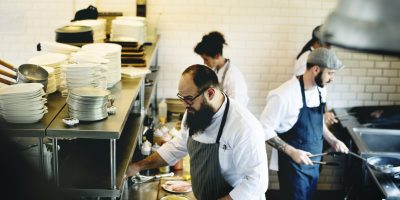 Group of chefs working in the kitchen