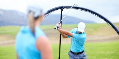 Ring, drive or beginner golfer in golf course lesson for fitness, workout or exercise to learn to swing. Coaching, golfing or male athlete training with instructor for driving with a club stroke.